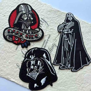 May include: A set of three ceramic mugs with a speckled, matte finish. The mugs are in shades of cream, light gray, and dark gray. Each mug has a simple, modern design and a rounded handle. Perfect for coffee or tea.