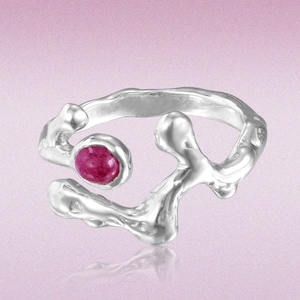 May include: A silver-toned ring with an organic, flowing design. The ring features a vibrant, round, ruby-colored gemstone. The open design wraps around the finger, showcasing a modern and artistic aesthetic. The ring is a statement piece.