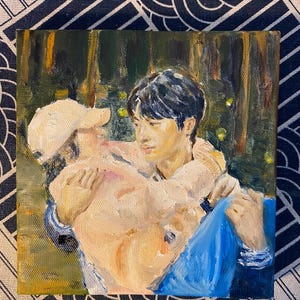 May include: An oil painting on canvas depicting two individuals in a forest setting. One person wears a light-colored baseball cap and a pale pink sweater, while the other wears a blue garment. The scene features visible brushstrokes and dark tones.