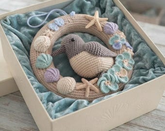 Patroon voor een Amigurumi-krans met strandlopertjes en schelpen en zeesterren voor de kinderkamer (PDF)
