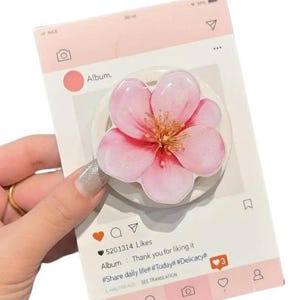 May include: A set of three ceramic mugs with a speckled, matte finish. The mugs are in shades of cream, light gray, and dark gray. Each mug has a simple, minimalist design, perfect for coffee or tea.