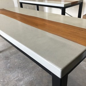 Concrete table with teak natural edge inlay Matching concrete dining tables Concrete and wood dining table Parsons table with metal base