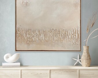 May include: A large, abstract painting with a textured, off-white surface and a dark brown frame. The artwork features a horizontal band of raised, vertical shapes near the bottom, with subtle details and variations in texture. The painting is displayed on a light blue wall.