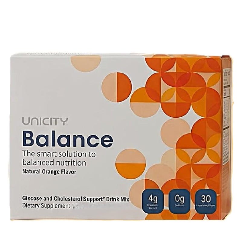 May include: A rectangular box of Unicity Balance dietary supplement drink mix in natural orange flavor. The white packaging features a geometric pattern of overlapping orange circles and dark blue text. It includes labels for 4g, 0g, and 30.