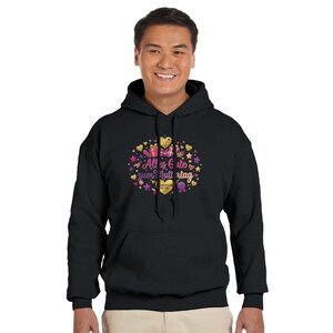 May include: Black hooded sweatshirt with a colorful graphic. The graphic includes hearts, stars, and the text "Alles Gute zum Muttertag". The design features gold, pink, purple, and yellow colors.