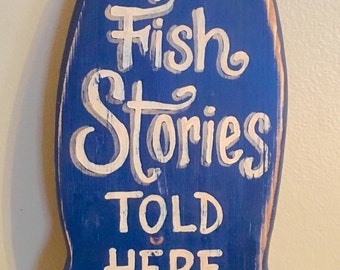 Fish Stories Told Here sign/blue hand painted/man cave/gifts for him/cabin decor/cottage decor/wooden fish sign/lake sign/garage sign