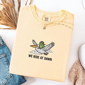 May include: A set of three ceramic mugs with a speckled, matte finish. Each mug features a different color: light blue, cream, and gray. The mugs have a simple, modern design, perfect for coffee or tea.