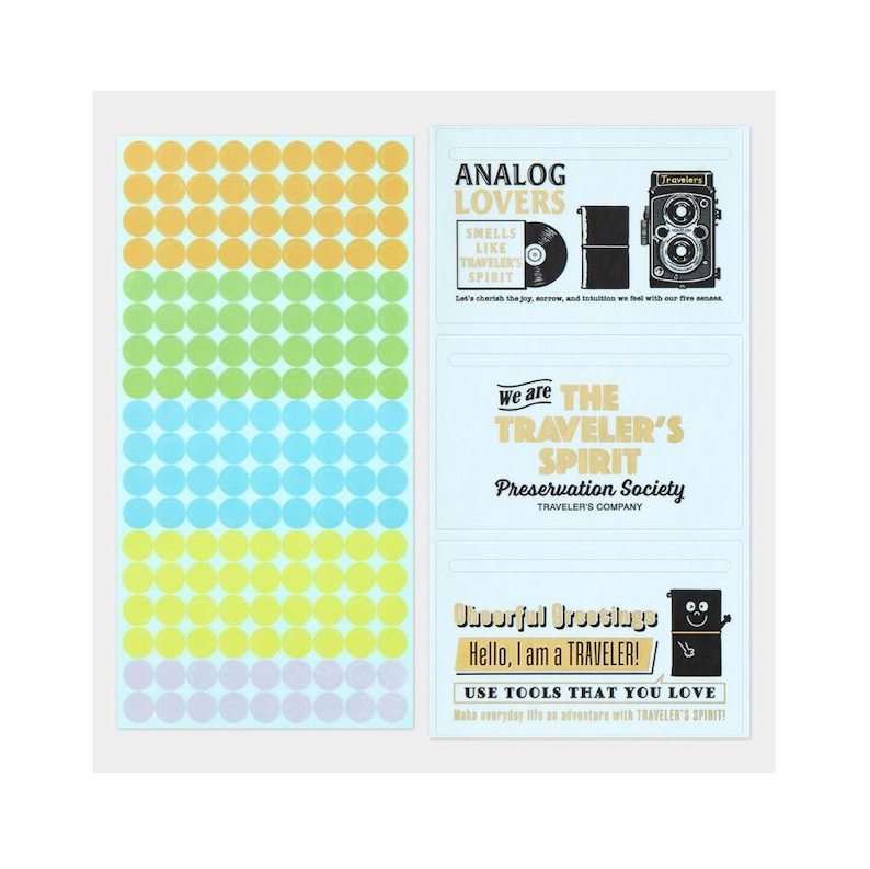 May include: A sticker sheet featuring a range of colours and text. The stickers include circular dots in yellow, orange, green, blue, and purple. Text includes "ANALOG LOVERS" and "TRAVELER'S SPIRIT".