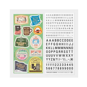 May include: A sheet of green stickers featuring travel-themed designs and a separate sheet of black letters and numbers. The stickers include phrases such as "Traveler's Spirit" and "Local Coffee".