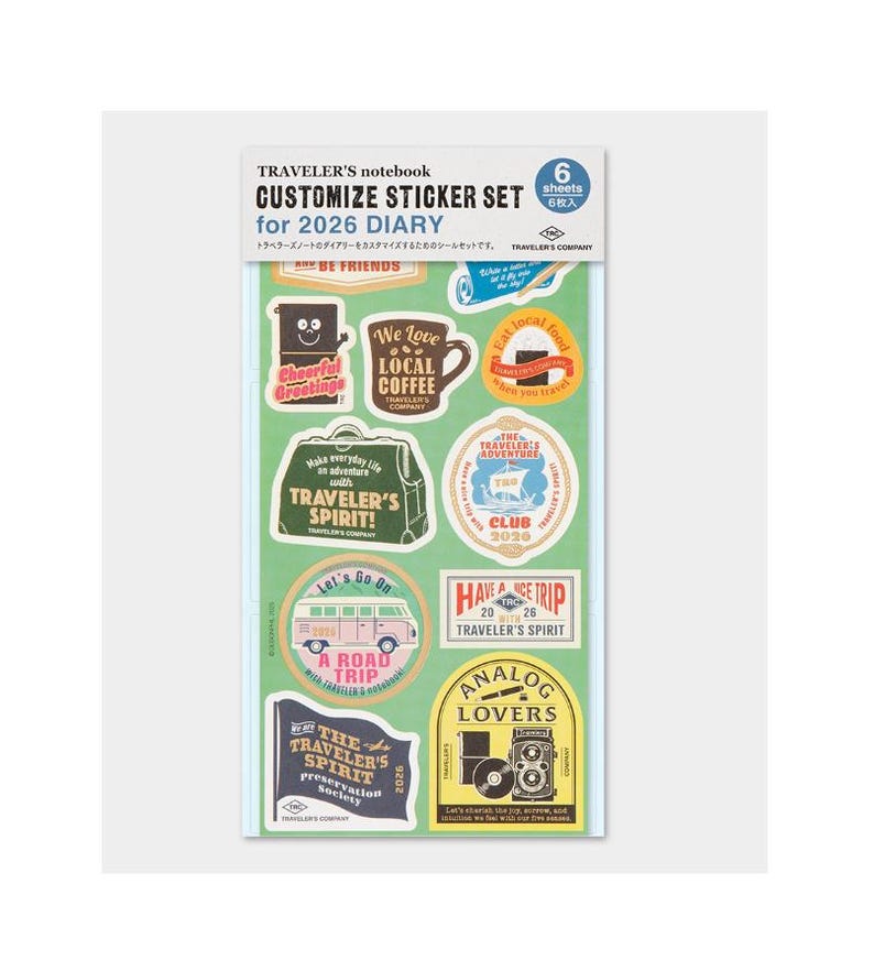 May include: A sticker set for a 2026 diary, with travel-themed designs. The stickers feature phrases such as "We Love Local Coffee," "Have a Trip," and "Traveler's Spirit!" The set includes 6 sheets.