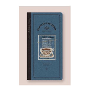 May include: Blue Traveler's Notebook featuring a vintage illustration of a cafe called "Kavarna Slavie" with a cup of coffee and the text "Republiky 26-Tel. 2222222"