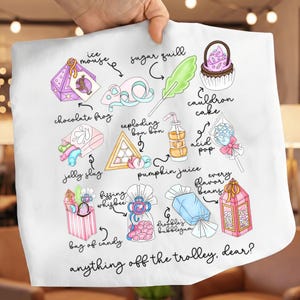 May include: White fabric with colorful illustrations of various candies and treats, including a chocolate frog, cauldron cake, and exploding bon bons. Text reads "anything off the trolley, dear?"
