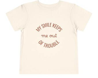 Mon sourire m'empêche d'avoir des ennuis T-shirt pour tout-petit | Chemise drôle pour enfants