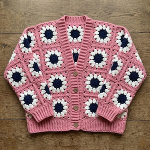 May include: A rustic wooden sign with the text "Welcome to our home" in white lettering. The sign features a distressed finish and a simple, inviting design, perfect for front door decor.