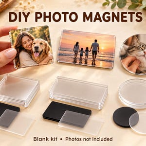 May include: A DIY photo magnet kit featuring clear acrylic frames in square, rectangular, and circular shapes. The set includes black magnetic backings and transparent covers for displaying photographs. Finished examples show a person with a dog, a family on a beach at sunset, and a cat. The text DIY PHOTO MAGNETS and Blank kit • Photos not included is visible.