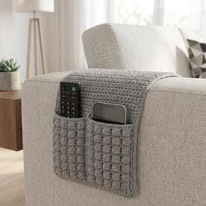 May include: A white ceramic mug with a black handle and the text "But First, Coffee" in a bold, black font. The mug is sitting on a wooden surface. The mug is approximately 4 inches tall.