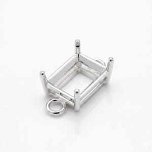 May include: A silver rectangular jewellery setting with four prongs and a small loop. The setting is designed to hold a gemstone and has a polished finish. The design is simple and elegant, suitable for various jewellery projects.