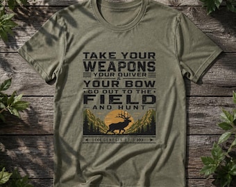 May include: An olive green short-sleeve t-shirt featuring black text that reads: TAKE YOUR WEAPONS YOUR QUIVER & YOUR BOW GO OUT TO THE FIELD AND HUNT GENESIS 27:3. Below the text is a graphic of a black deer silhouette against a yellow sun and mountains.
