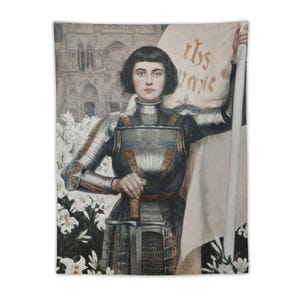 May include: Tapestry featuring a portrait of Joan of Arc in armor, holding a sword and a banner with text. The artwork has a vintage aesthetic, with a cathedral in the background and white lilies in the foreground.