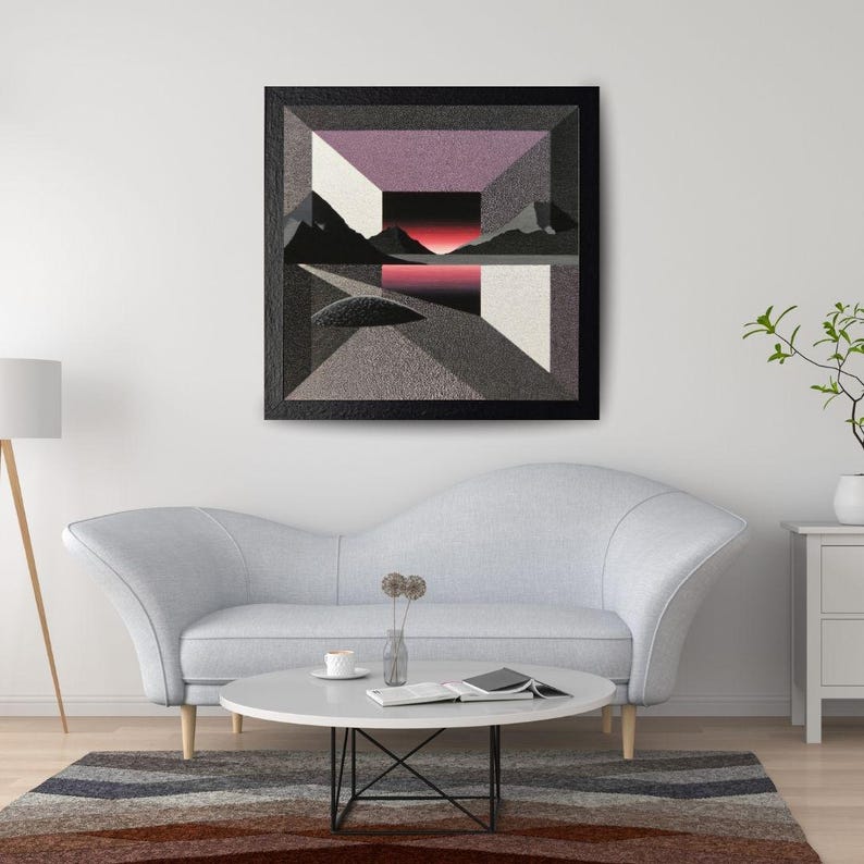 May include: Abstract geometric wall art featuring a landscape scene with mountains, a lake, and a sunset. The artwork uses a palette of gray, black, white, and shades of purple and red. The piece is framed in a black rectangular frame.