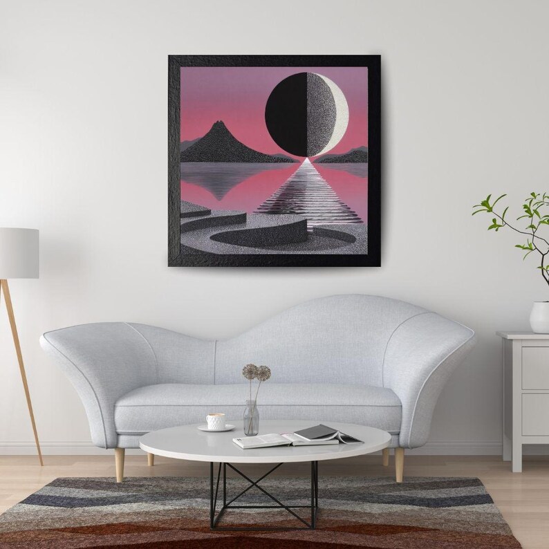 K&ouml;nnte beinhalten: Ein gerahmter Kunstdruck mit einer surrealen Landschaft mit einer schwarz-wei&szlig;en Kugel, die von einem Pfad halbiert wird. Das Kunstwerk hat einen rosa-violetten Himmel, eine Bergkette und ein reflektierendes Gew&auml;sser. Der Rahmen ist schwarz.