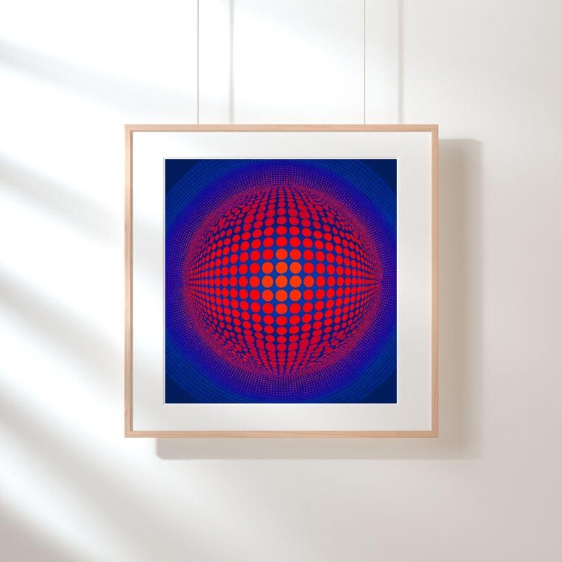 May include: Framed artwork with an abstract design. The image displays a spherical pattern made of red and orange dots on a dark blue backdrop. The artwork is enclosed in a light wood frame, offering a contemporary look, suitable for various interior styles.