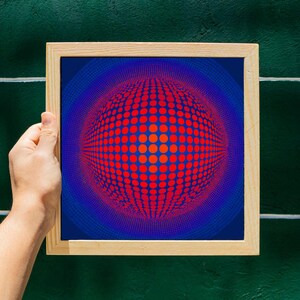 May include: A framed print with an abstract design. The artwork displays a spherical pattern of red dots on a blue background, framed in natural wood. The design creates a 3D effect, with a gradient of colours.