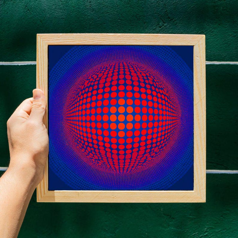 May include: A framed print with an abstract design. The artwork displays a spherical pattern of red dots on a blue background, framed in natural wood. The design creates a 3D effect, with a gradient of colours.