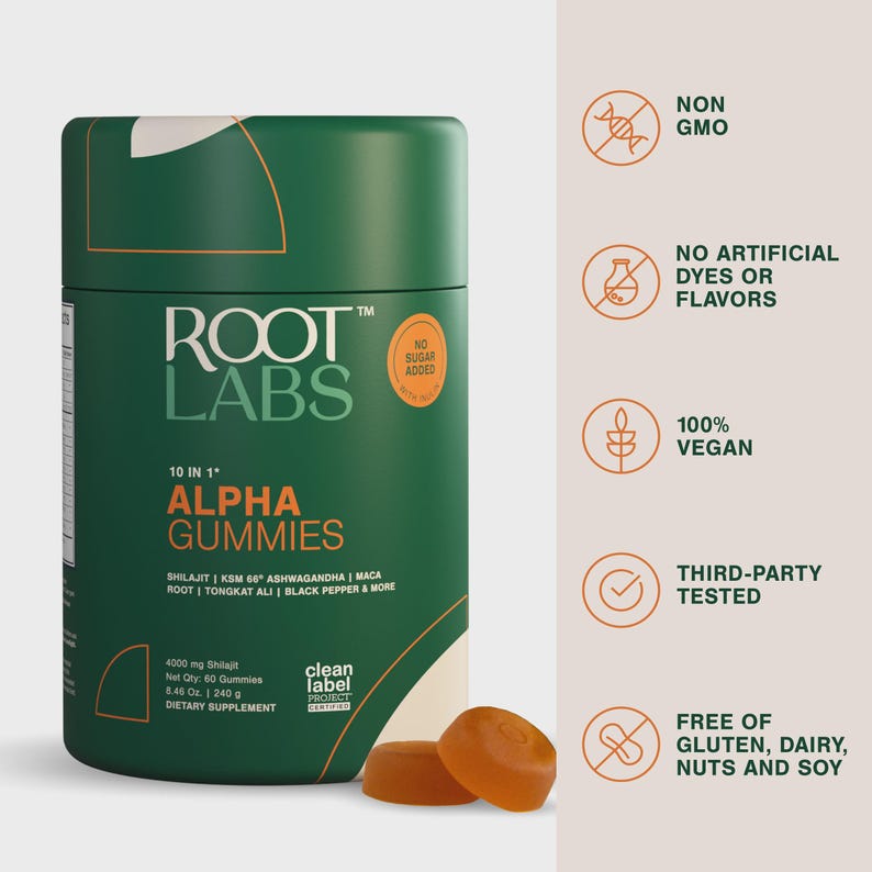 May include: A dark green cylindrical bottle of Root Labs Alpha Gummies dietary supplement. The label features white and orange text, including 10 in 1, Shilajit, and KSM 66 Ashwagandha. Two orange gummies sit in front. Icons list non-GMO and vegan status.