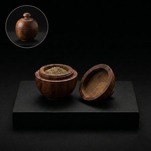 May include: A small, spherical dark brown wooden container with a removable lid. The container is open, revealing a fine, light-coloured powder inside. A circular inset shows the same wooden container with the lid securely closed on top.