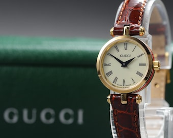 Nahezu neuwertige Vintage-Damenuhr GUCCI 2000L, 21 mm, elfenbeinfarbenes Zifferblatt, Sherry-Linie, Quarzwerk, mit Etui.