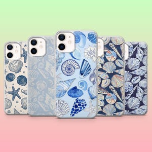 May include: Five clear smartphone cases arranged in a row, each featuring a distinct blue and white seashell and starfish pattern. The designs range from light blue backgrounds with sparse illustrations to dark blue backgrounds with dense patterns.