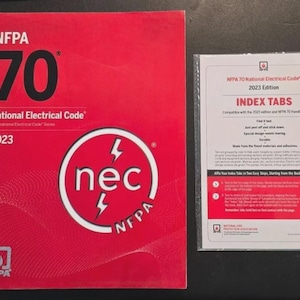 May include: A red book titled "NFPA 70 National Electrical Code 2023" with a white and red logo. Next to it is a packet of index tabs for the code. The index tabs are labeled "INDEX TABS".