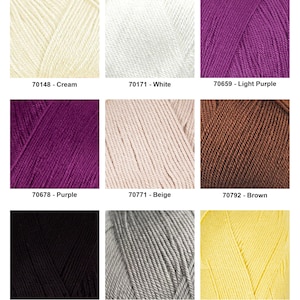 May include: A collection of nine yarn skeins in various colors, including cream, white, light purple, purple, beige, brown, black, grey, and light yellow. Each skein is labeled with a color name and a numerical code.