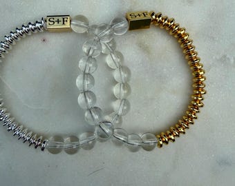 Pulseras de cuarzo transparente con hematita plateada o dorada.