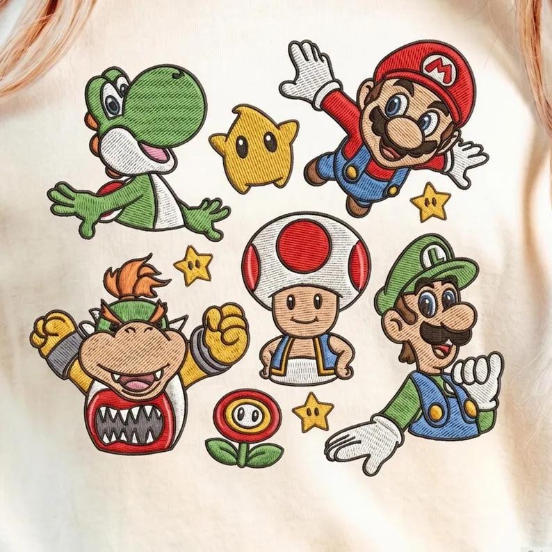 May include: Embroidered design featuring characters from the Super Mario Bros. franchise. Includes Mario, Luigi, Yoshi, Bowser, Toad, a Star, and a Fire Flower. The design is in shades of red, green, yellow, and blue on a cream-colored background.