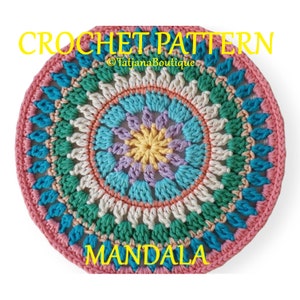 May include: A colorful crochet mandala pattern with a pink, white, green, blue, and yellow color scheme. The pattern is called "MANDALA" and is by "TatjanaBoutique".