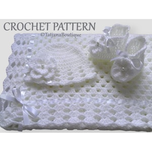 May include: White crochet baby blanket, hat and booties set. The set features a delicate floral design and white satin ribbon accents. Crochet pattern by TatjanaBoutique.