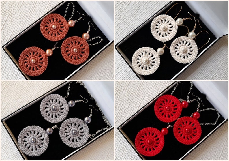 May include: Four pairs of crocheted earrings with pearl accents. The earrings are displayed in black boxes. The colors of the earrings are red, white, gray, and orange.