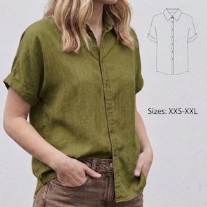 May include: Olive green short-sleeved shirt with a button-down front. The shirt features a classic collar and is made from a lightweight material. Sizes available: XXS-XXL. A line drawing of the shirt is in the upper right corner.
