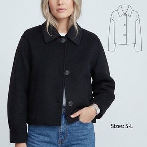 May include: A black, button-down jacket with a collar, worn over a white shirt and blue jeans. The jacket has three buttons and a small pocket on each side. A line drawing of the jacket is in the upper right corner. Sizes: S-L.