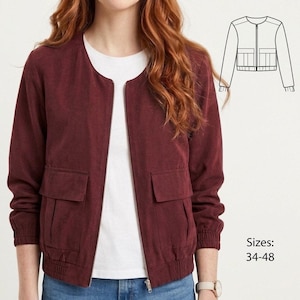 May include: A burgundy bomber jacket with a zipper closure and two front pockets. The jacket has a round neckline and ribbed cuffs and hem. The sizes available are 34-48.