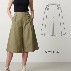 Puede incluir: Pantalones culotte verde oliva con botones grandes y oscuros y bolsillos. Los pantalones de cintura alta se combinan con una camiseta sin mangas negra. Un dibujo lineal de los pantalones culotte se muestra a la derecha, con el texto "Sizes: 38-42".