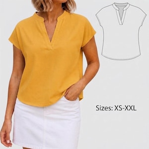 May include: A mustard yellow short-sleeved blouse featuring a split V-neckline and a curved hemline. The garment is paired with a white skirt. A black and white line drawing of the blouse is shown in the corner with the text Sizes: XS-XXL.