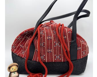 Bolso tote japonés Kinchaku, de tela de seda tejida roja de Kioto.