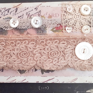 Two lengths of vintage lace, presented on pretty postcard with pearly buttons,