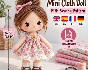 May include: A cloth doll with brown yarn hair in a bun, a pink hair bow, and a floral dress with a wooden button. The doll is 6.3 inches tall. Text reads Mini Cloth Doll, PDF Sewing Pattern, Digital Download, and language codes EN, ES, FR, DE.