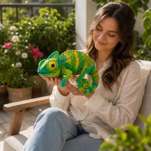 May include: A crocheted chameleon toy featuring a vibrant color palette of lime green, bright yellow, and turquoise blue. The stuffed animal has a textured surface, a curled tail, and a large, prominent eye with a dark pupil and yellow iris.
