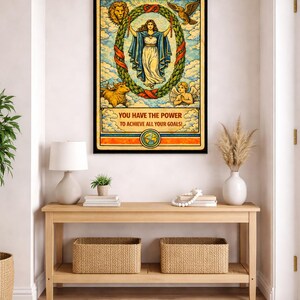 May include: A framed tarot card print featuring "The World" card. The artwork depicts a woman within a laurel wreath, surrounded by symbolic figures. The text "YOU HAVE THE POWER TO ACHIEVE ALL YOUR GOALS!" is displayed at the bottom.
