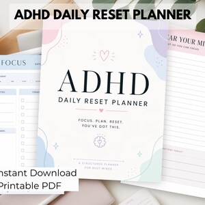 May include: A stack of ADHD Daily Reset Planners with a soft pastel color scheme. The main planner features the title "ADHD Daily Reset Planner" with the text "Focus. Plan. Reset. You've got this." Also includes "Instant Download" and "Printable PDF" text.